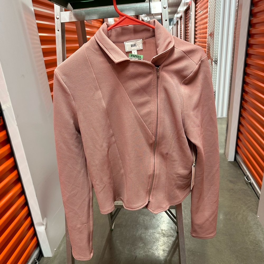 Im selling this blazer I never got toit definitely will work out for any beauty.